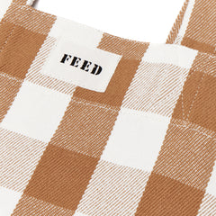 Ochre Gingham | Detail shot of FEED logo on ochre gingham Carryall