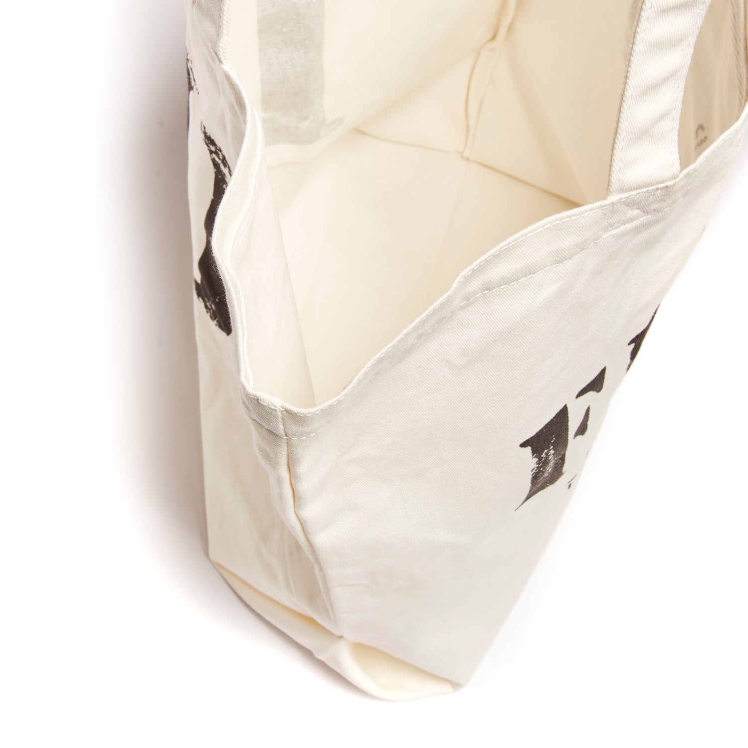 White | Interior of FEED 10 tote bag in white. 