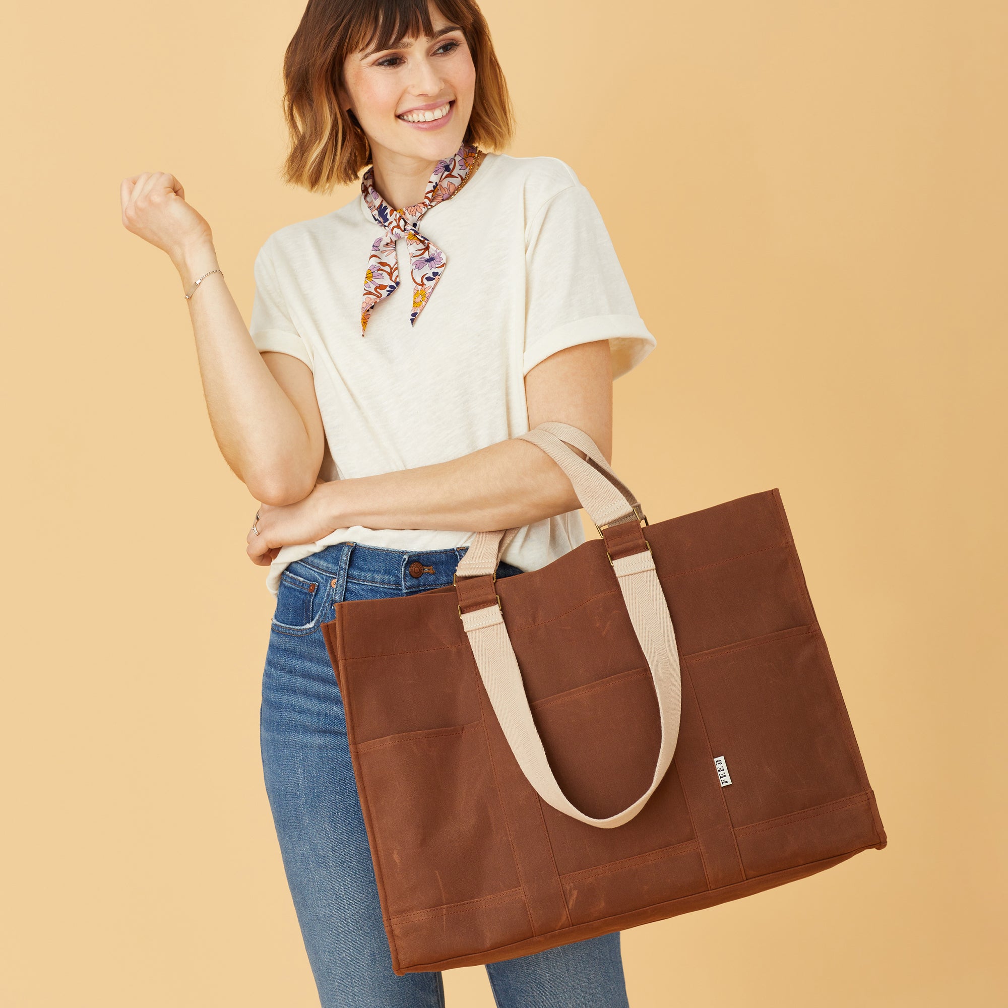 Brown | Model with brown organizer bag. 